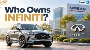 A silver Infiniti SUV parked outside a modern Nissan building, with an Infiniti logo sign on the right and the headline “Who Owns INFINITI?” above.